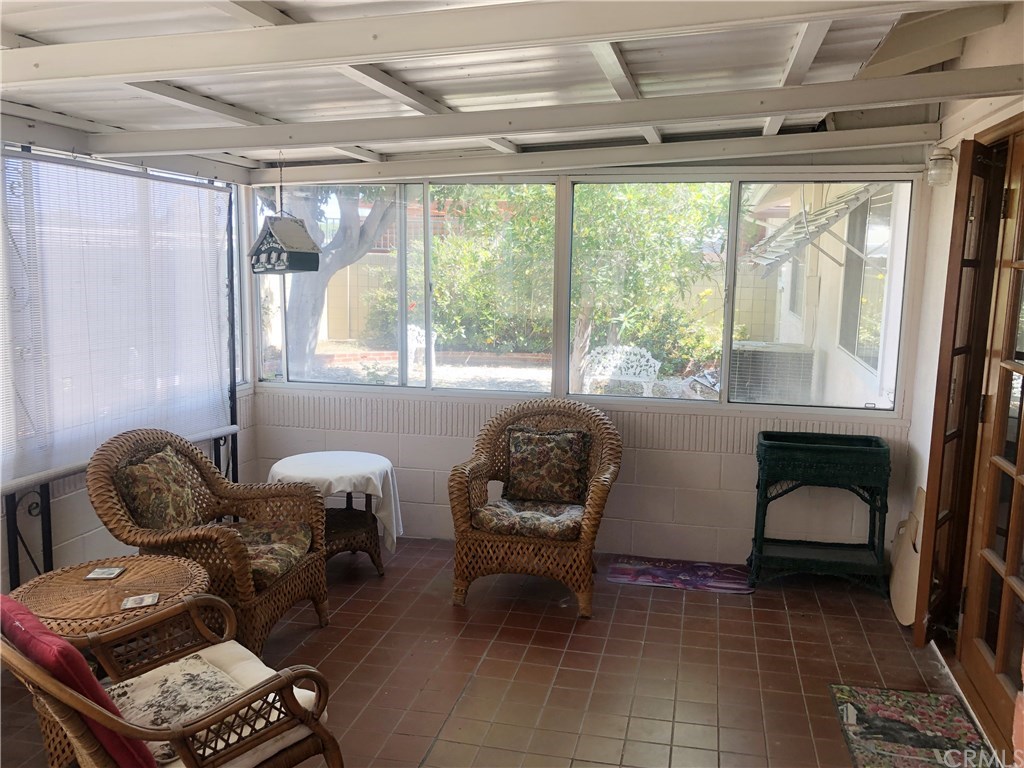 273 Harvard Lane Seal Beach, CA 90740 - Photo 15 of 43 The french doors from the family room lead to this enclosed patio. It is 11' x 17'. Add approximately 187 sq. ft to the home.