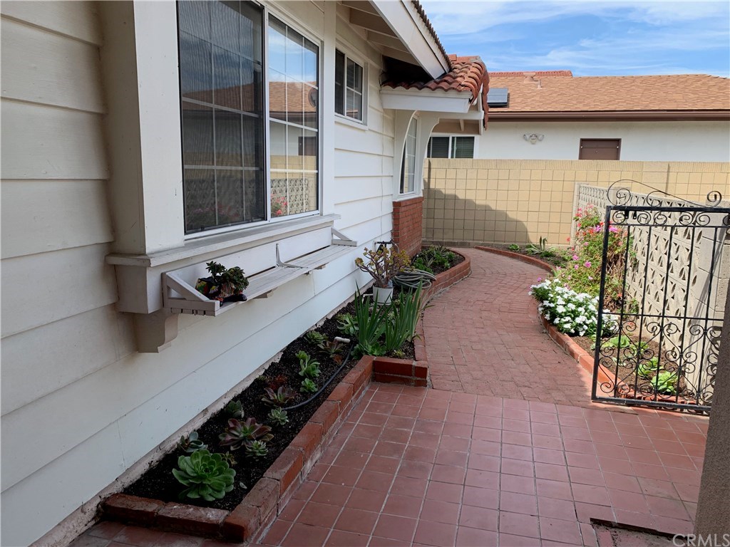 273 Harvard Lane Seal Beach, CA 90740 - Photo 3 of 43 Charming front porch and brick bath.