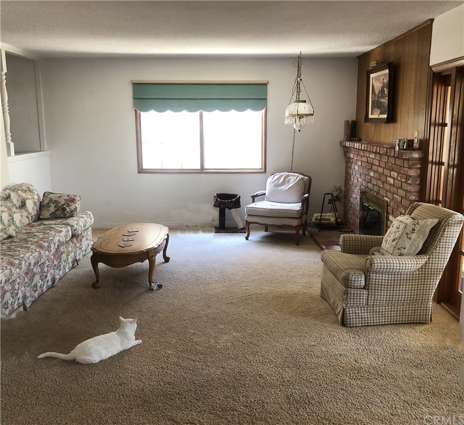 273 Harvard Lane Seal Beach, CA 90740 - Photo 7 of 43 Spacious Family Room with Brick Fire Place.