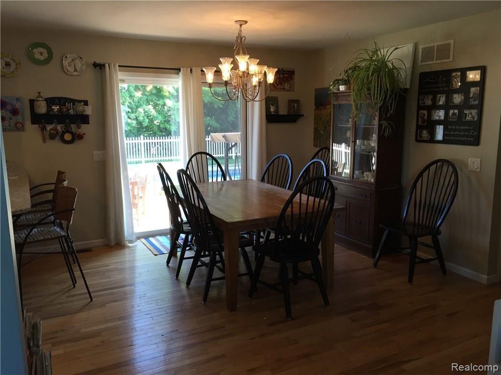 4678 Willis Road North Branch, MI 48461 - Photo 11 of 41 Dining Room with Slider to Deck and Pool Area