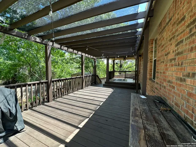 a view of balcony with wooden floor