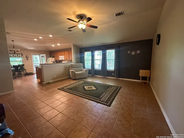 a view of a hallway with furniture