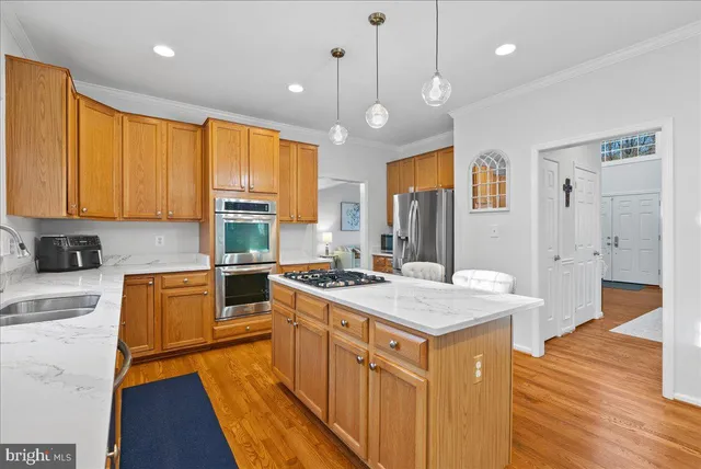 a kitchen with a table and chairs in it
