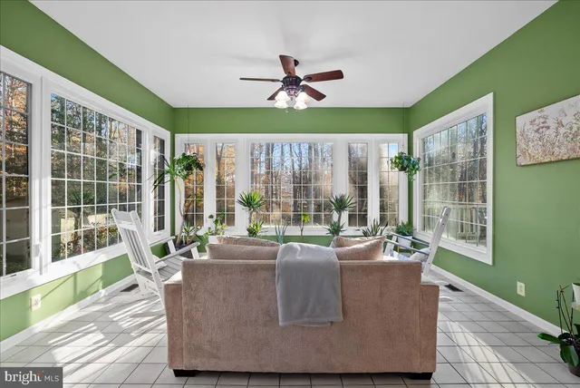 a view of a hallway with wooden floor and stairs