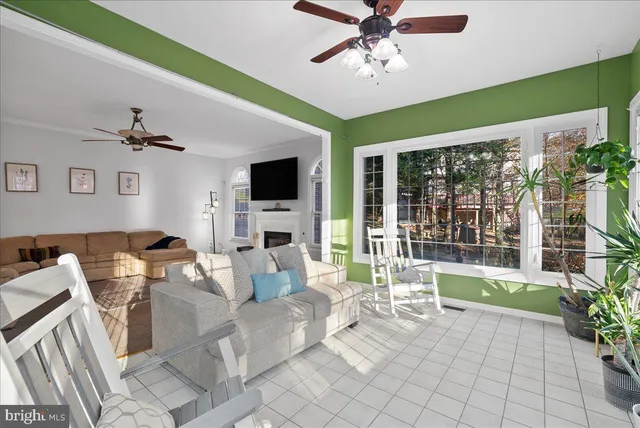 a bedroom with a bed mirror and window