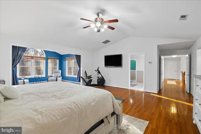 a bedroom with a bed and painted walls