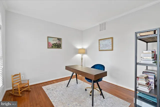 a workspace with furniture and lamp on dresser