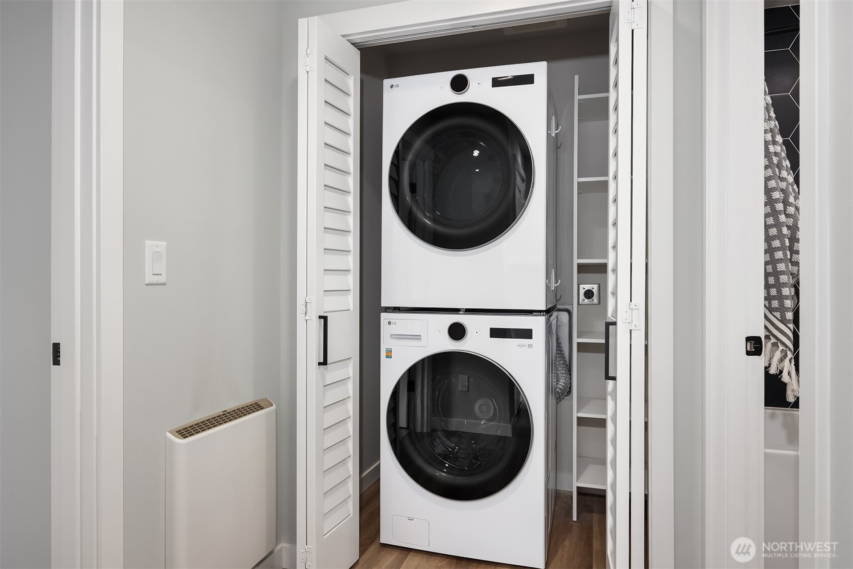516 North 61st Street, Unit B Seattle, WA 98103 - Photo 15 of 17 a utility room with dryer and washer