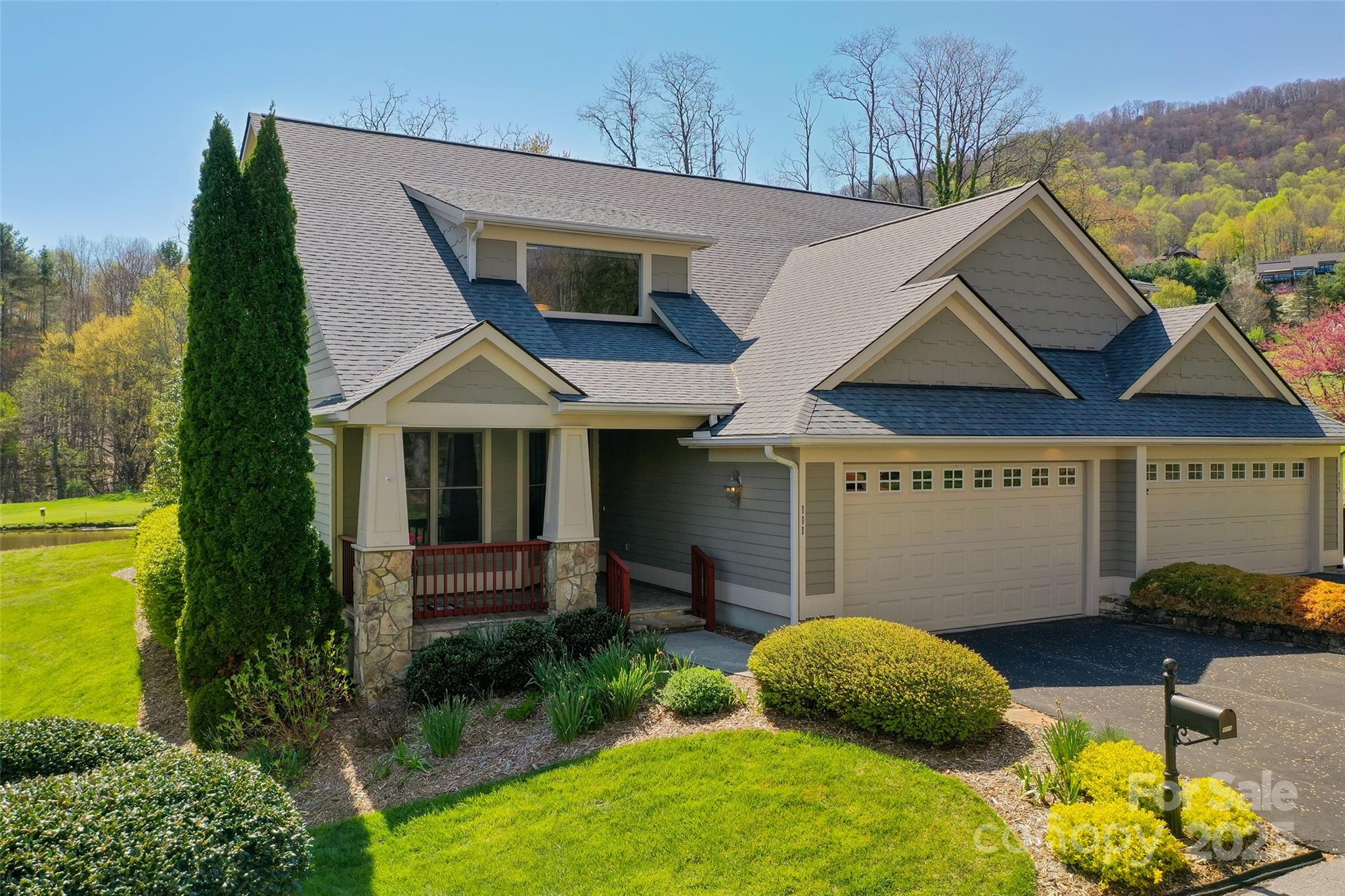 111 Augusta Circle Waynesville, NC 28786 - Photo 1 of 41 a front view of a house with garden