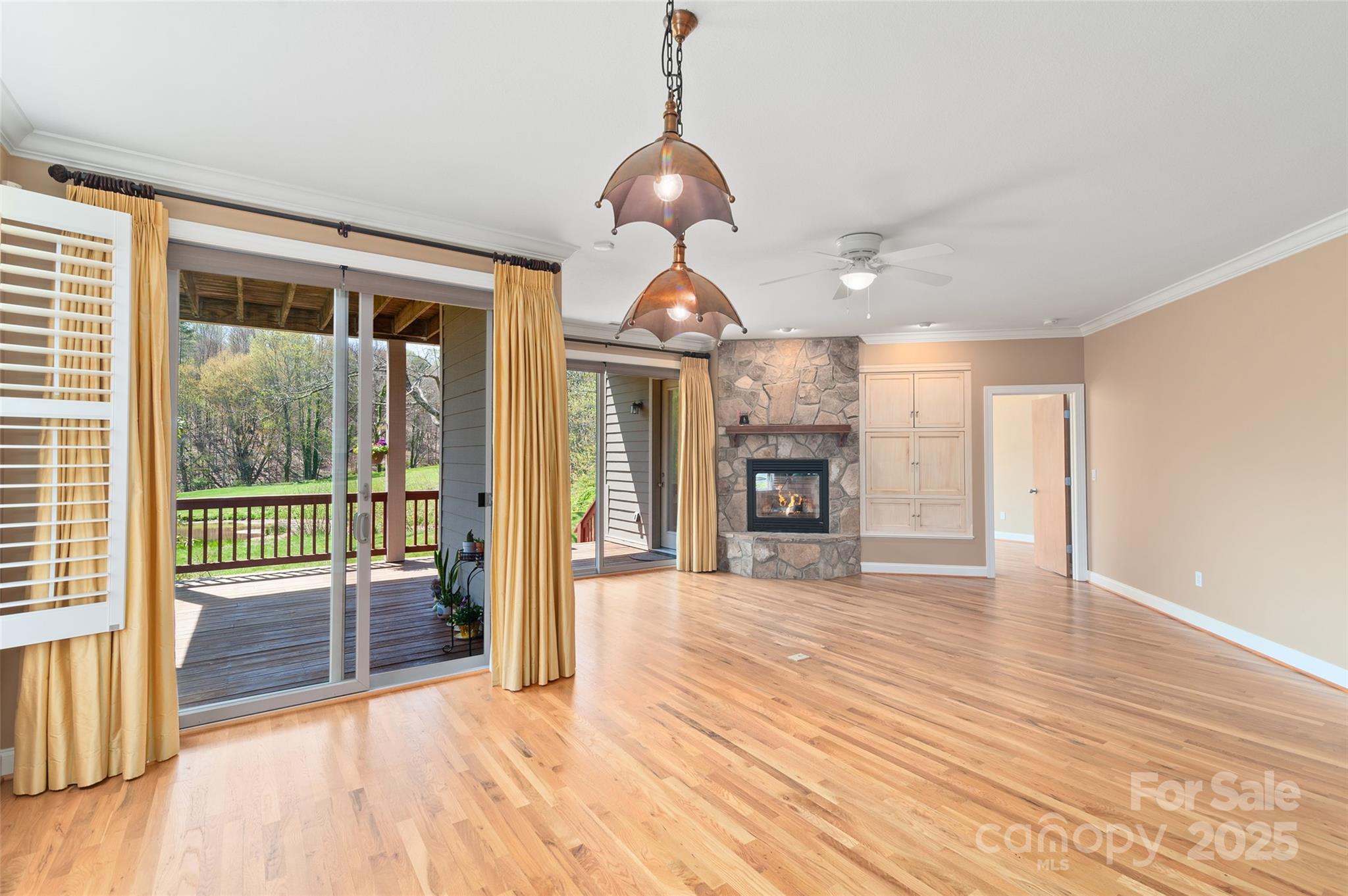 111 Augusta Circle Waynesville, NC 28786 - Photo 17 of 41 a view of empty room with wooden floor and fireplace