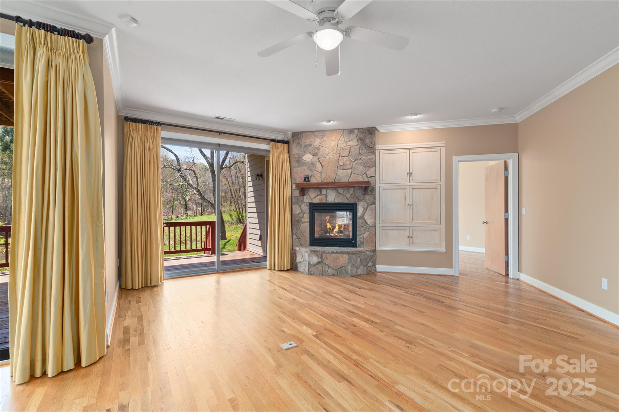 111 Augusta Circle Waynesville, NC 28786 - Photo 18 of 41 wooden floor fireplace and windows in an empty room