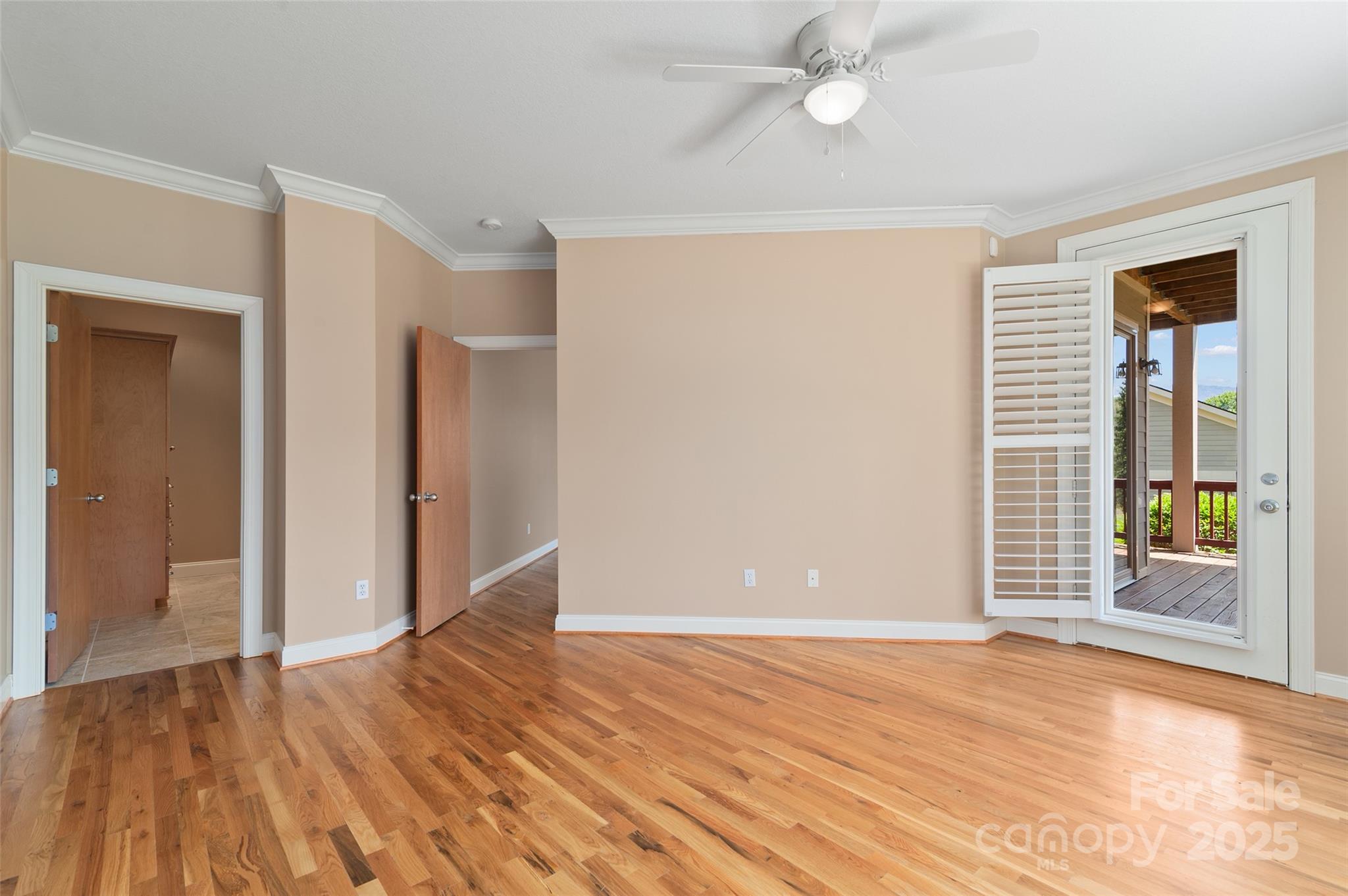 111 Augusta Circle Waynesville, NC 28786 - Photo 20 of 41 an empty room with wooden floor and windows