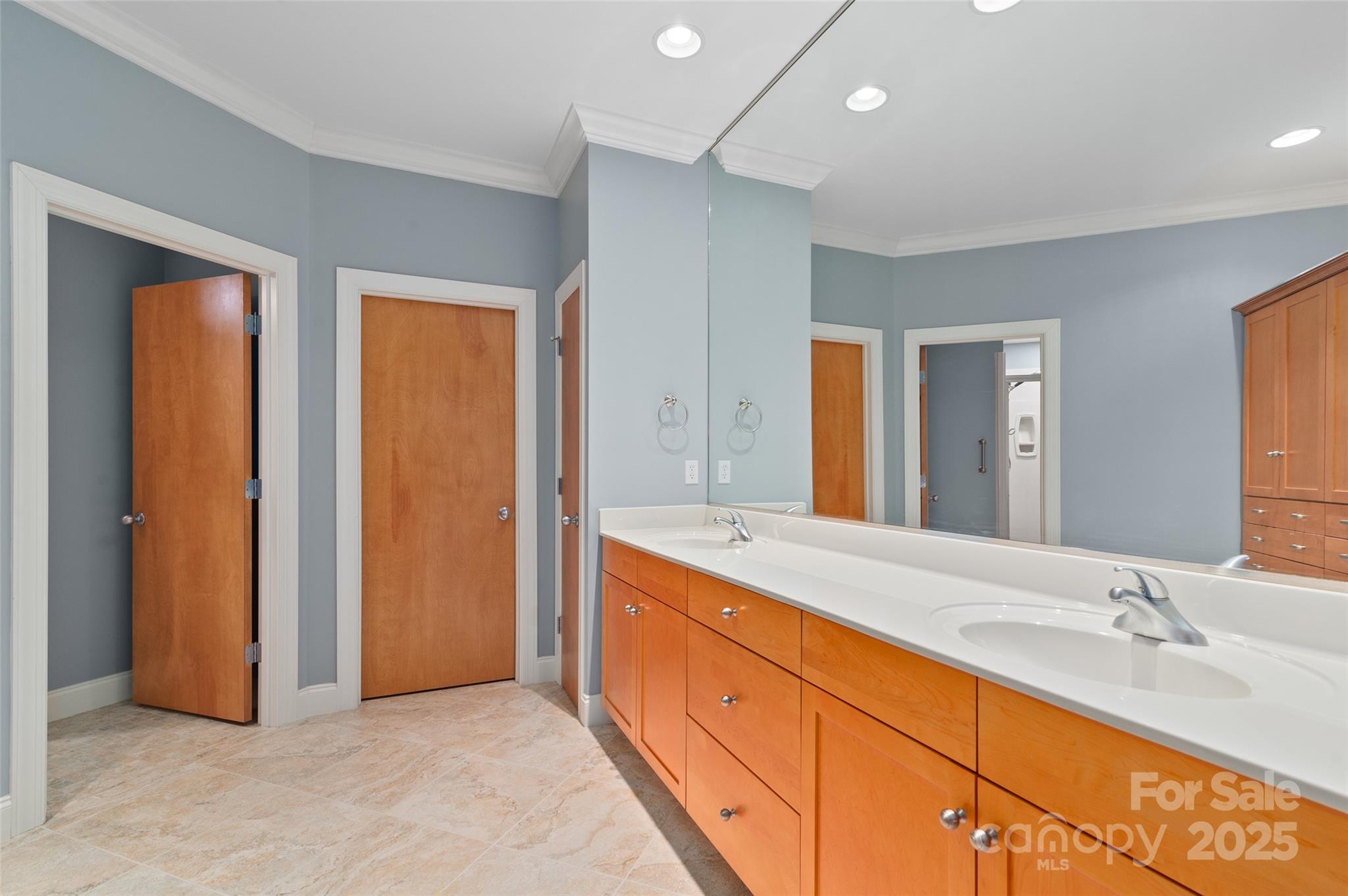 111 Augusta Circle Waynesville, NC 28786 - Photo 22 of 41 a spacious bathroom with a double vanity sink and a mirror