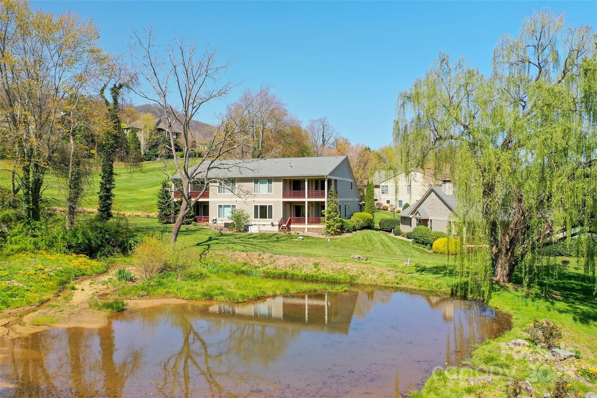111 Augusta Circle Waynesville, NC 28786 - Photo 3 of 41 a front view of a house with a yard