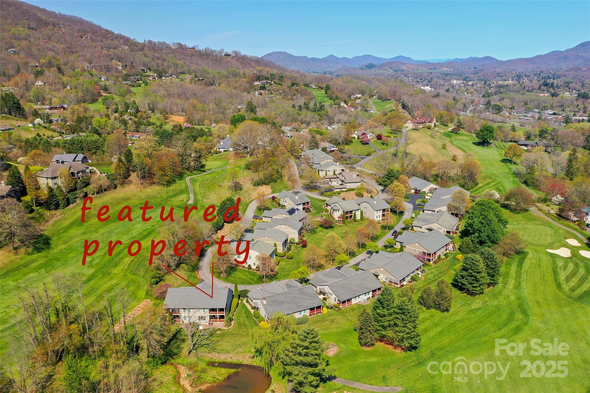 111 Augusta Circle Waynesville, NC 28786 - Photo 38 of 41 a view of a lush green hillside and houses
