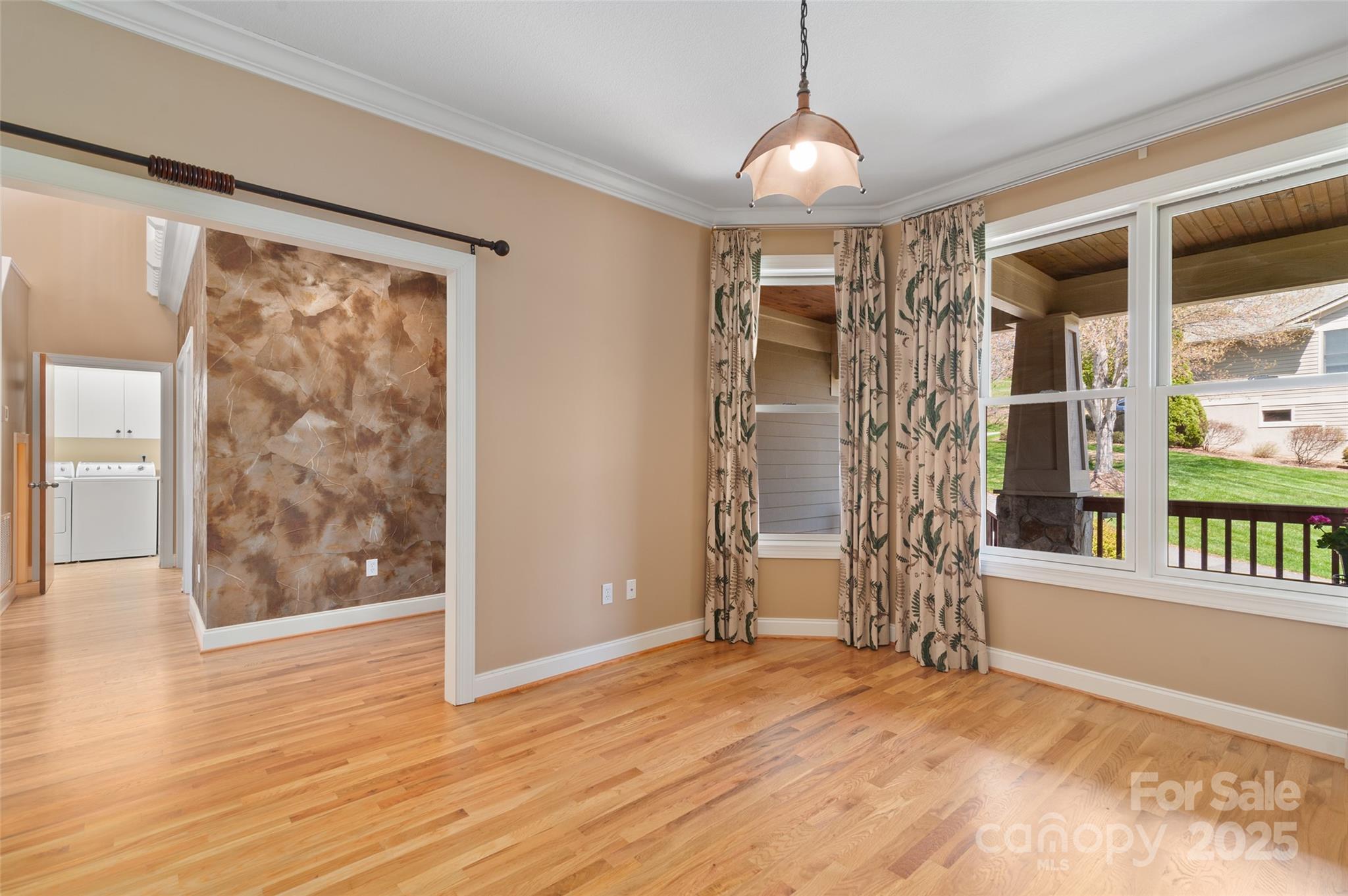 111 Augusta Circle Waynesville, NC 28786 - Photo 8 of 41 a view of empty room with wooden floor and fan