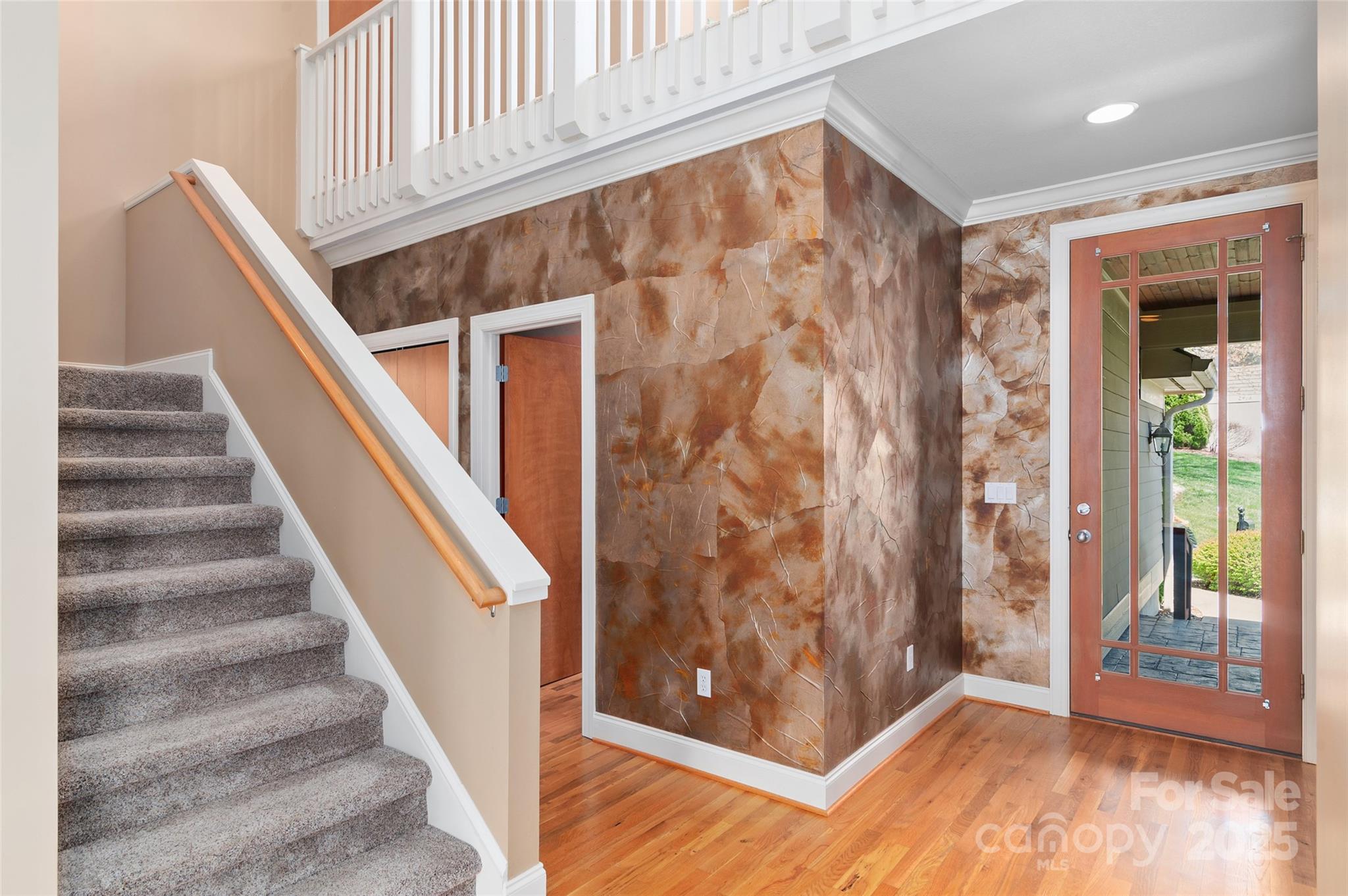 111 Augusta Circle Waynesville, NC 28786 - Photo 9 of 41 a view of entryway with wooden floor and stairs