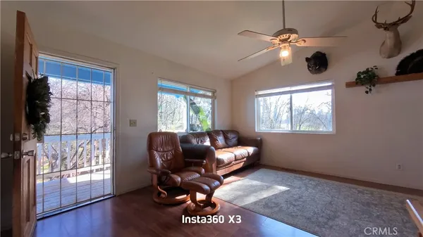 a livingroom with workspace and a window