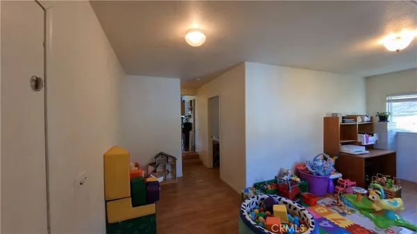 a room with toys and wooden floor