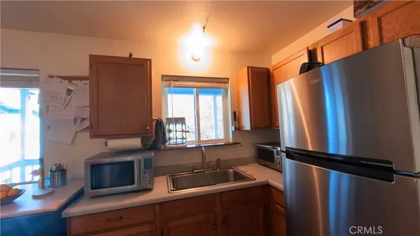a kitchen with stainless steel appliances a refrigerator and a sink