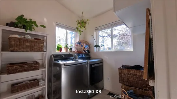 a kitchen with stainless steel appliances granite countertop a stove and a refrigerator