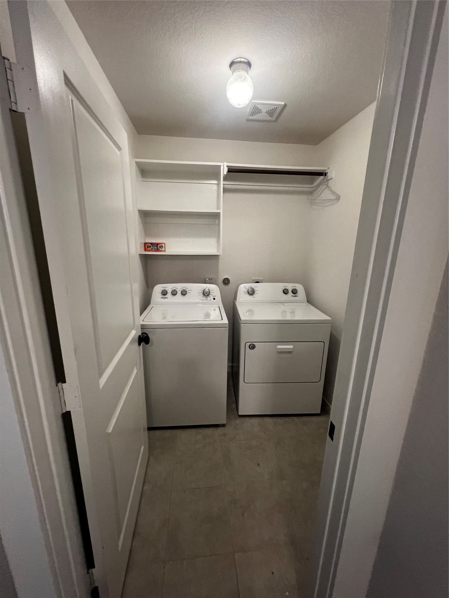 9214 Melmack Drive Rosharon, TX 77583 - Photo 11 of 14 a utility room with dryer and washer