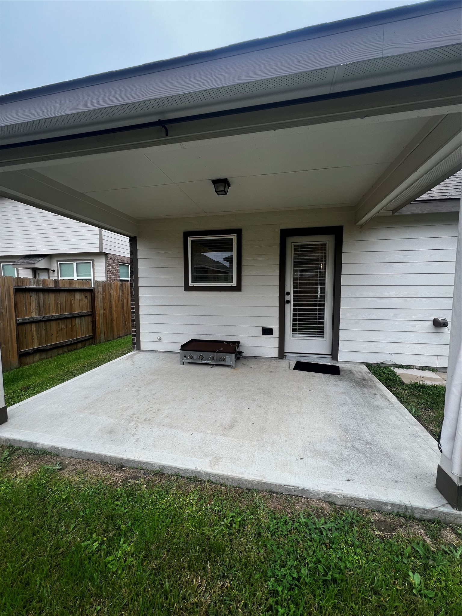9214 Melmack Drive Rosharon, TX 77583 - Photo 14 of 14 a front view of a house with a yard