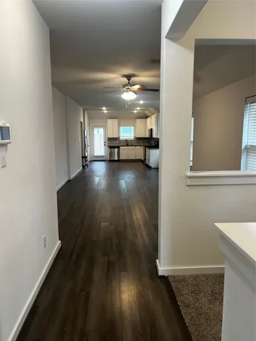 a view of a livingroom with wooden floor