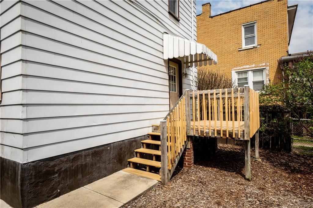 222 Ann Street McKees Rocks, PA 15136 - Photo 14 of 24 Brand new deck accessible from the kitchen makes grilling convenient.