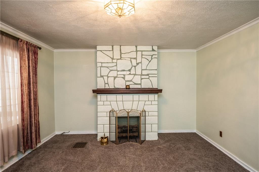 222 Ann Street McKees Rocks, PA 15136 - Photo 17 of 24 View of decorative fireplace in the living room. Gas line is present, but currently capped.