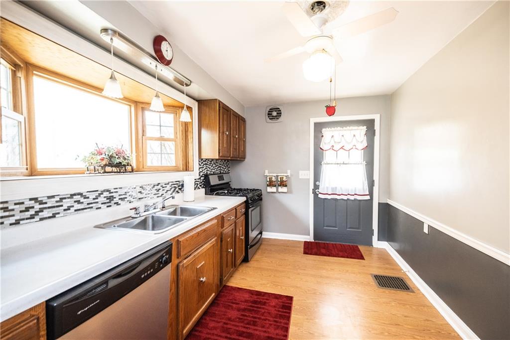 222 Ann Street McKees Rocks, PA 15136 - Photo 19 of 24 Alternate view of kitchen with ceramic tile backsplash and garden/herb window allowing in bright light.