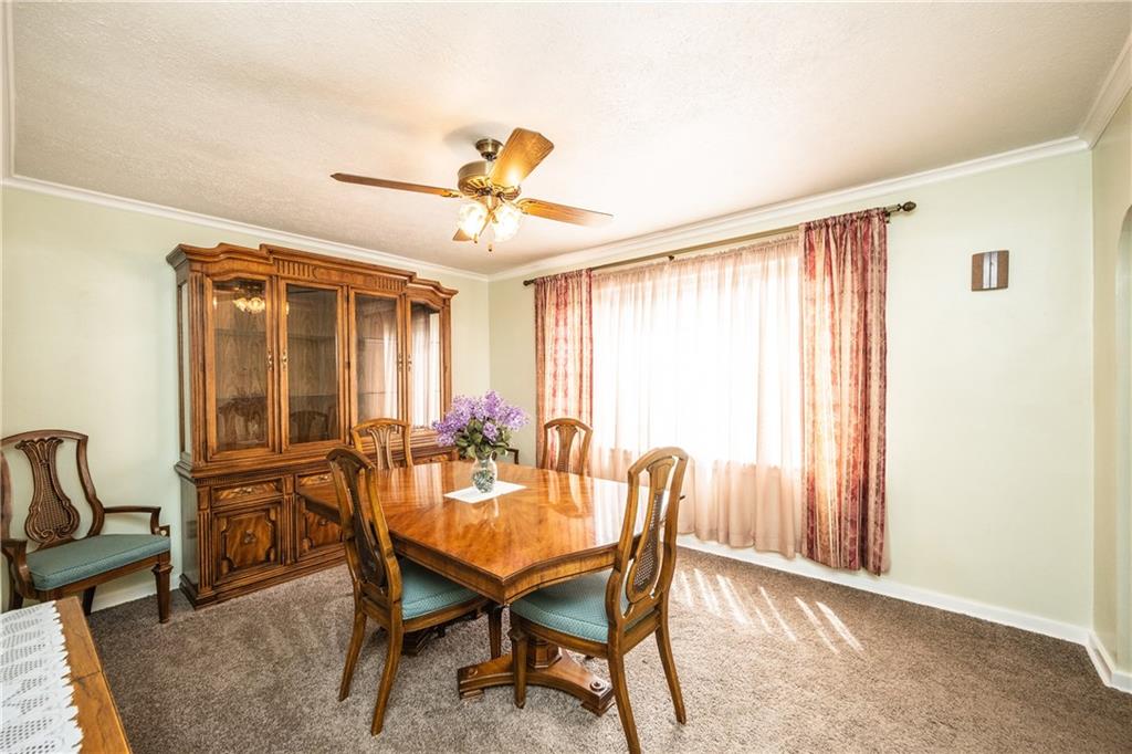 222 Ann Street McKees Rocks, PA 15136 - Photo 3 of 24 Dining room also has crown molding, newer carpet & a large window that lets in tons of natural light.