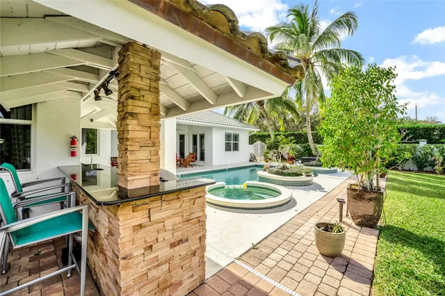 a dining room with furniture and a garden