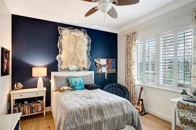 a bedroom with a bed and a table in it