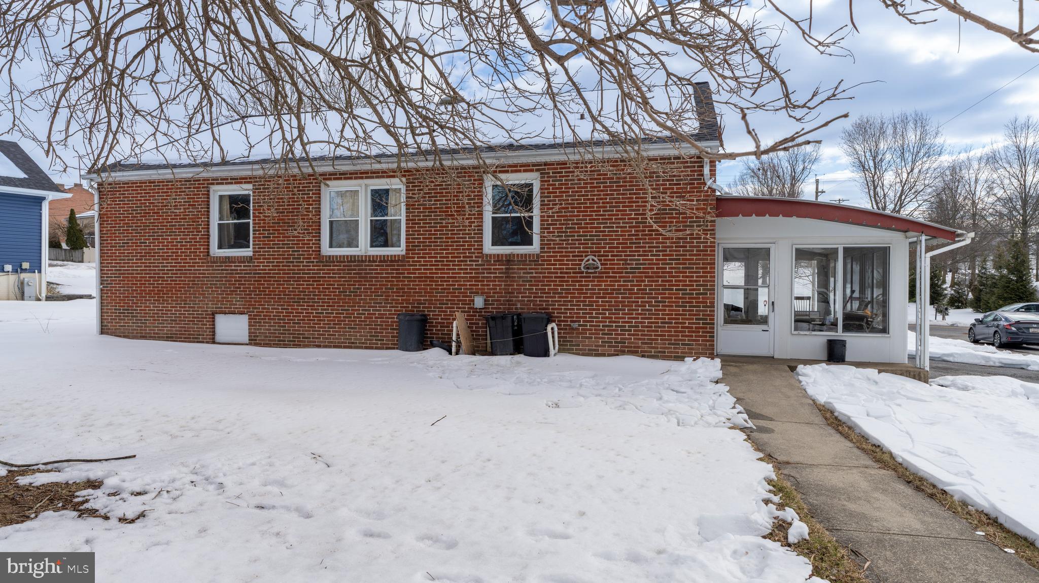 4516 East Joppa Road Perry Hall, MD 21128 - Photo 2 of 7 a front view of a house with a yard covered in snow