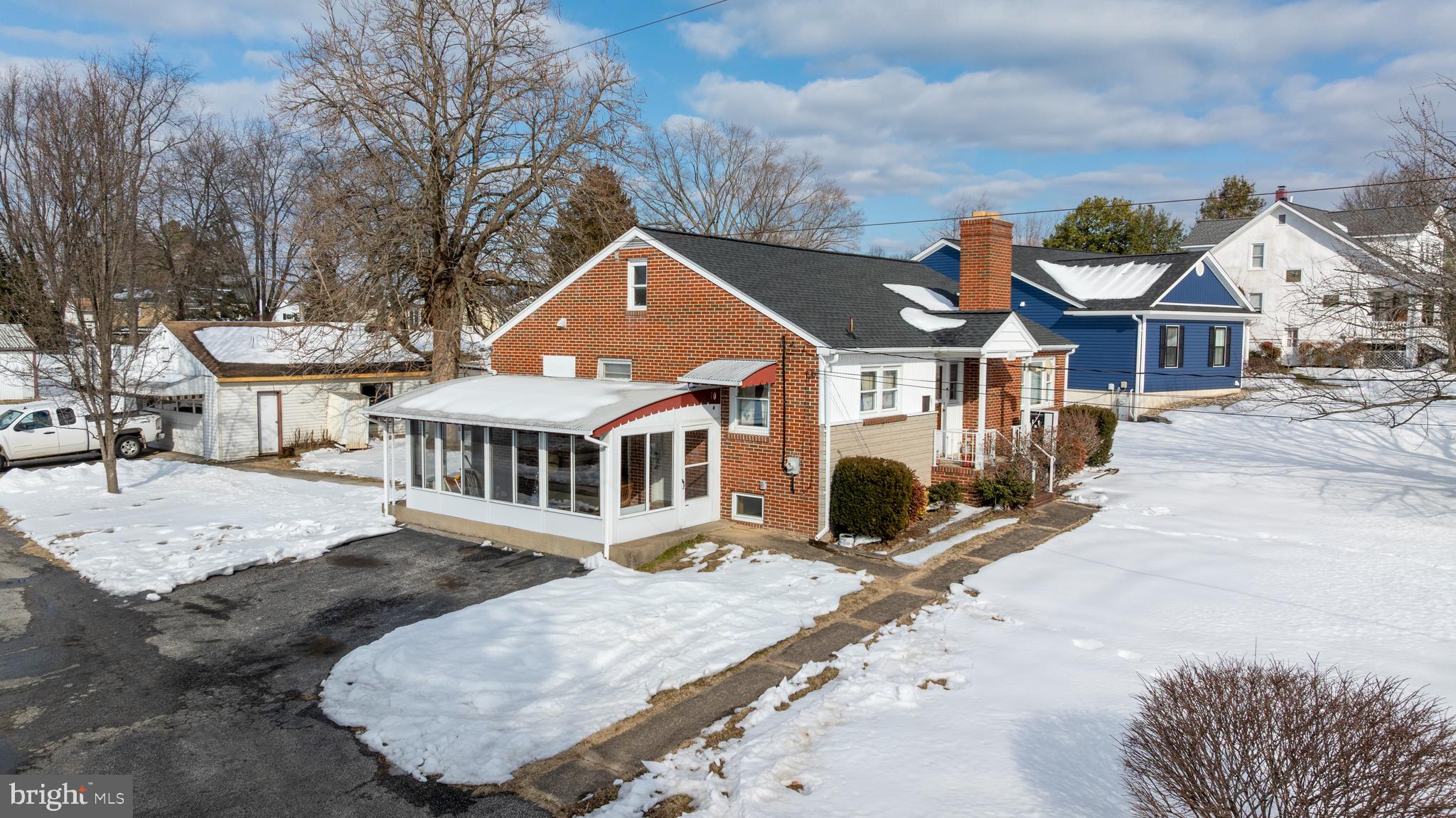 4516 East Joppa Road Perry Hall, MD 21128 - Photo 5 of 7 an aerial view of a house with a yard and large trees