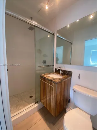 a kitchen with stainless steel appliances a refrigerator a stove a microwave and cabinets