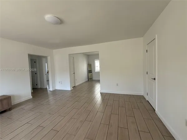 a view of an empty room with a window