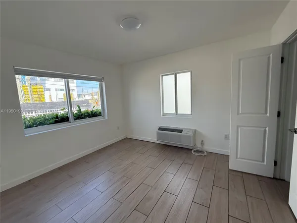 a view of a bedroom from the hallway