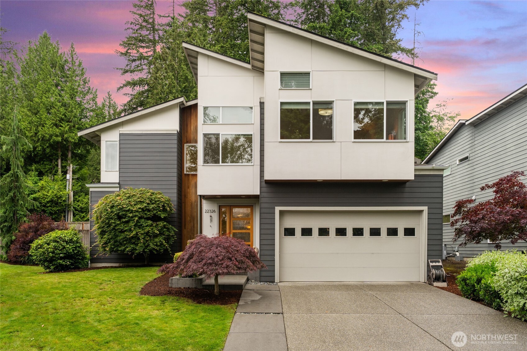 22326 2nd Place Southeast Bothell, WA 98021 - Photo 2 of 40 a front view of a house with a garden and plants