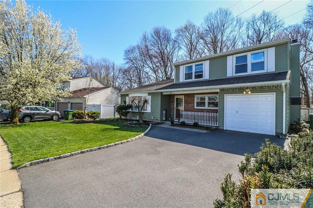 24 Ridge Road Edison, NJ 08817 - Photo 1 of 25 front view of a house with a yard