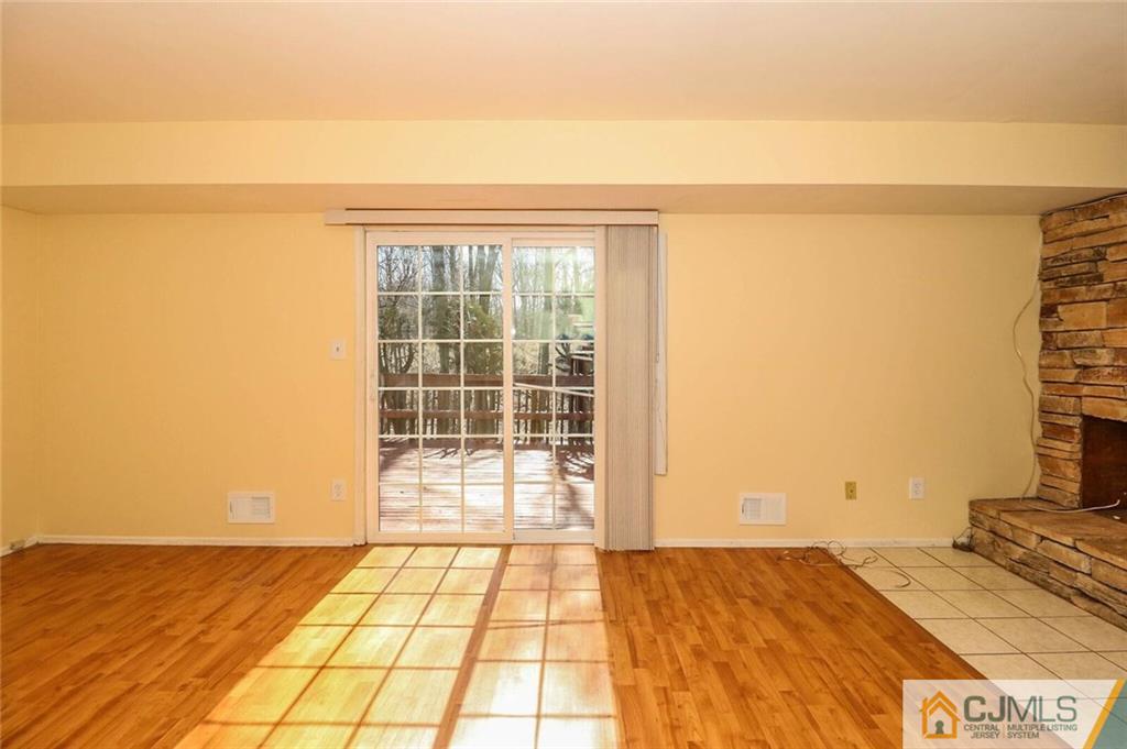 24 Ridge Road Edison, NJ 08817 - Photo 3 of 25 a view of a livingroom with an empty space and a window
