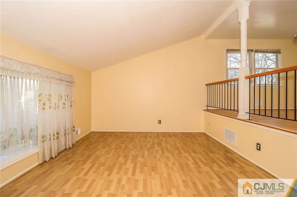 24 Ridge Road Edison, NJ 08817 - Photo 4 of 25 a view of entryway with wooden floor