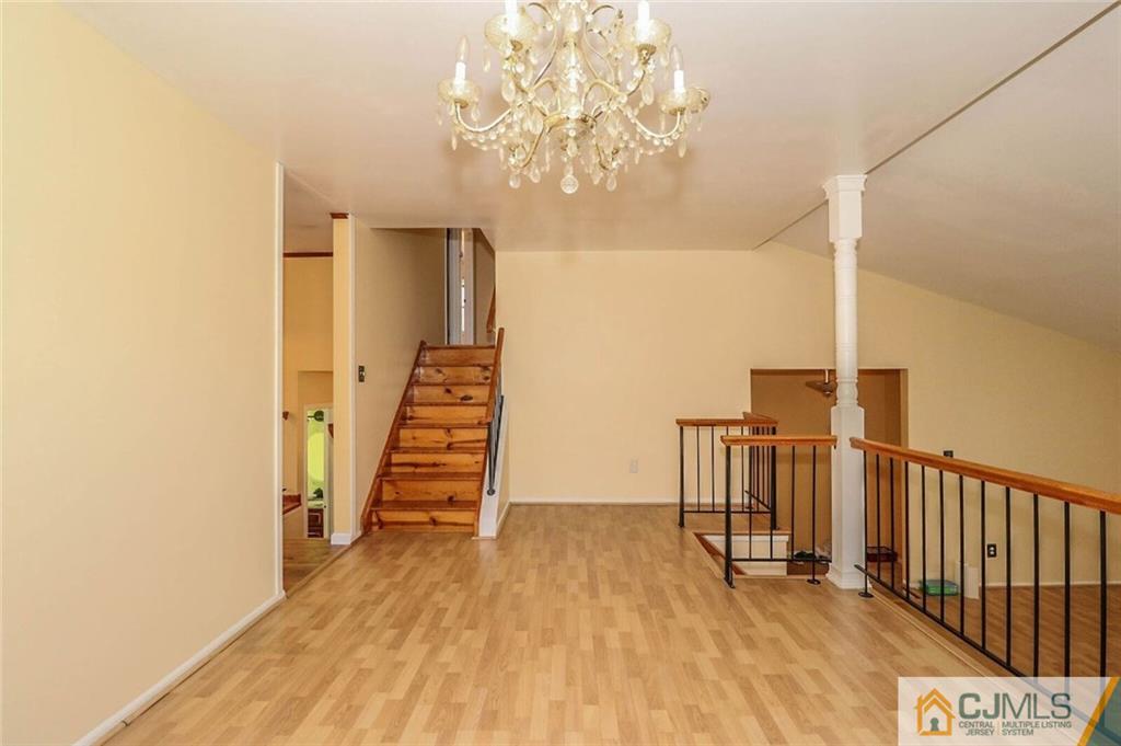 24 Ridge Road Edison, NJ 08817 - Photo 6 of 25 a view of a hallway with stairs