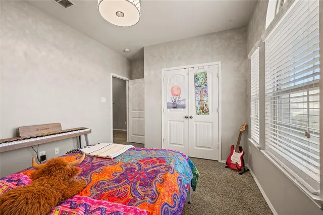 a view of an chairs and table in patio with a wooden fence