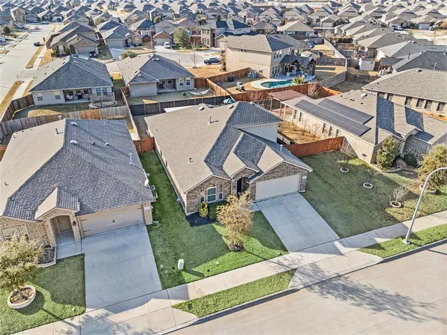 front view of a house with a garden