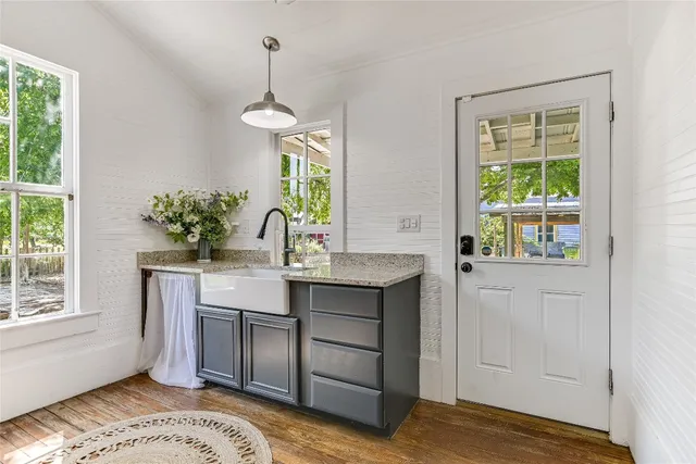 a kitchen with a sink and cabinets