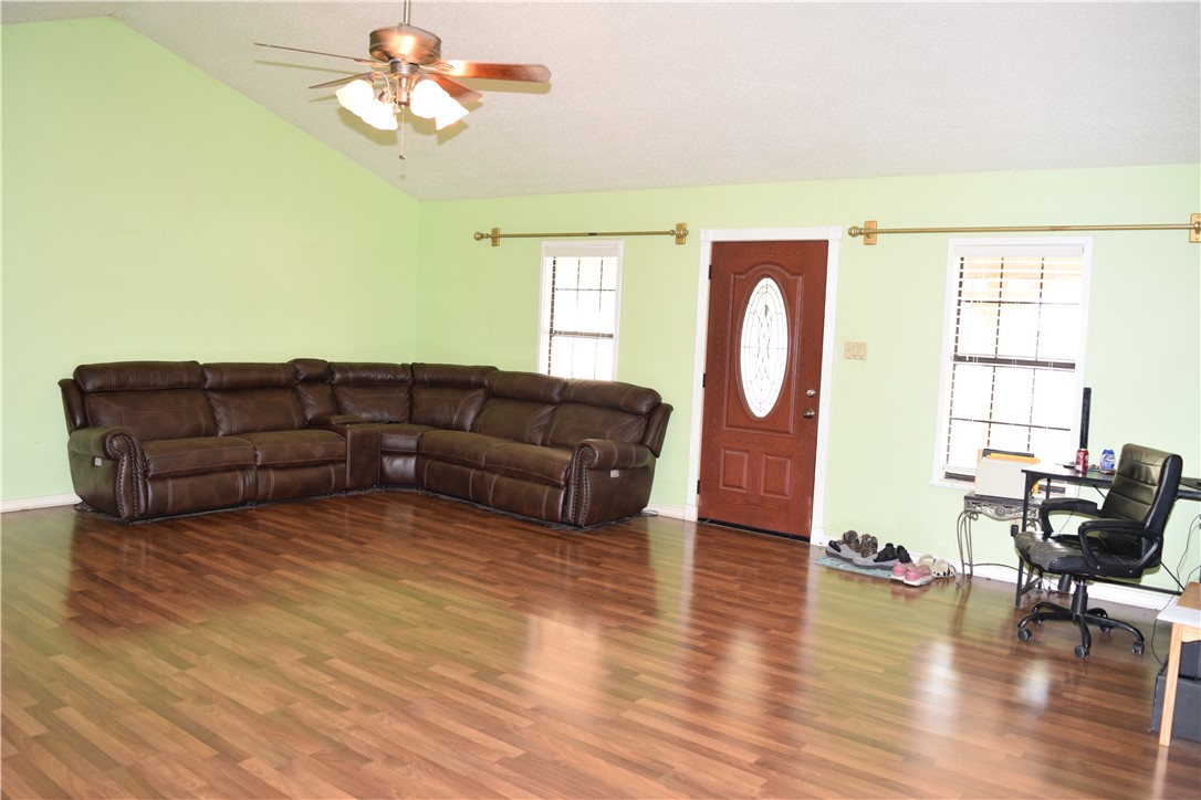 24772 County Road 360 Mathis, TX 78368 - Photo 3 of 30 a living room with furniture two window and wooden floor
