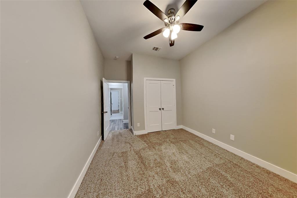237 Giddings Trail Forney, TX 75126 - Photo 13 of 18 an empty room with a chandelier fan and windows