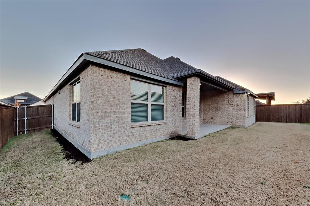 237 Giddings Trail Forney, TX 75126 - Photo 16 of 18 a view of a house with a yard and garage